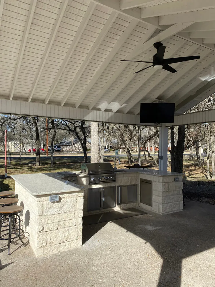 patio cover and white outdoor kitchen