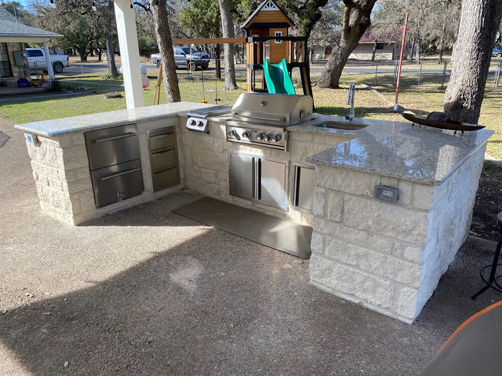 beautiful outdoor kitchen with matching stainless steel appliances