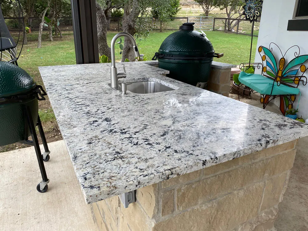 white marble outdoor kitchen