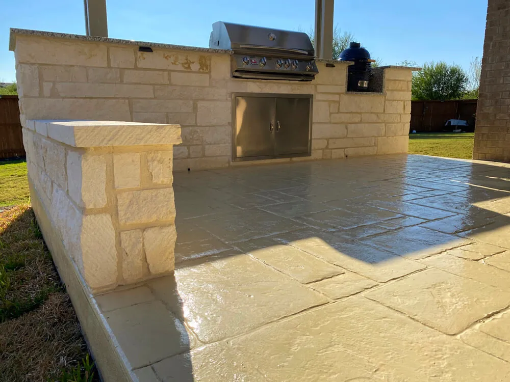 bottom view of an outdoor kitchen made of white concrete