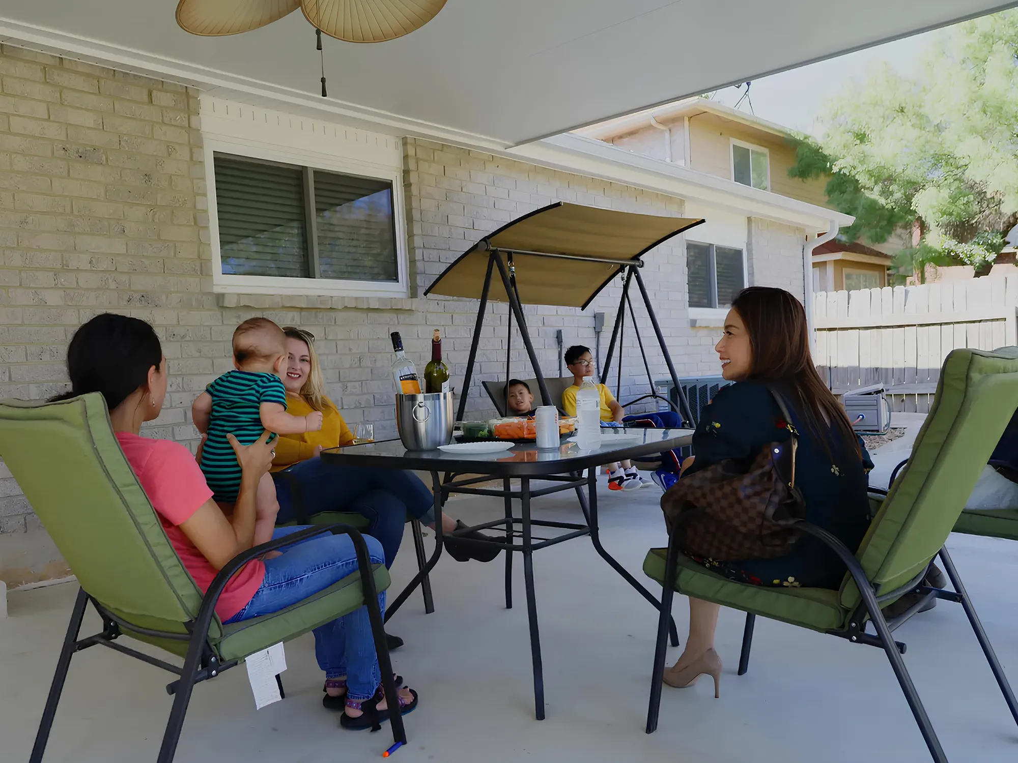 texas homeowners relaxing under their new patio cover
