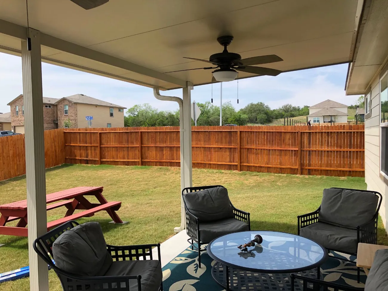 screenless patio with fan and patio furnature