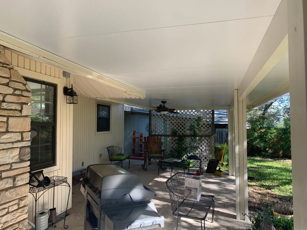 patio cover with multicolored brick siding