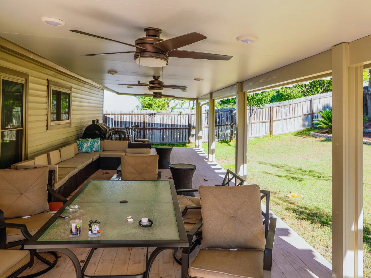 patio cover with two large fans in beacon hill texas
