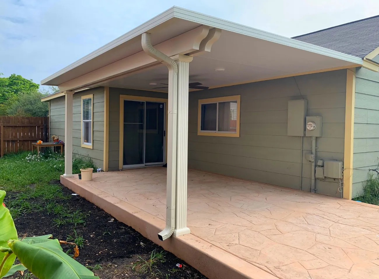 patio cover atop red deck in gardendale