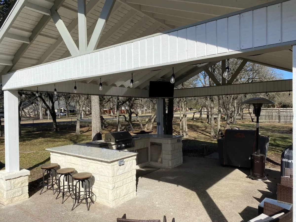 extra large white patio cover over a outdoor kitchen in san antonio