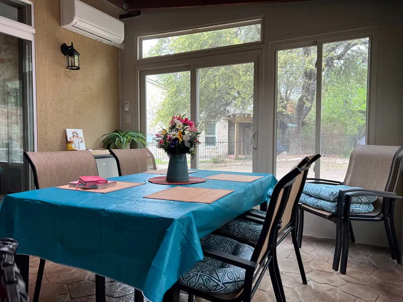 San Antonio enclosed patio with dining table.