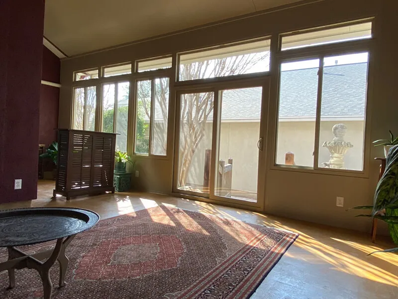 Sunlit patio enclosure, indoor view, San Antonio.