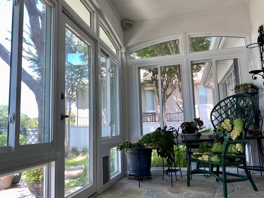 Enclosed patio with greenery