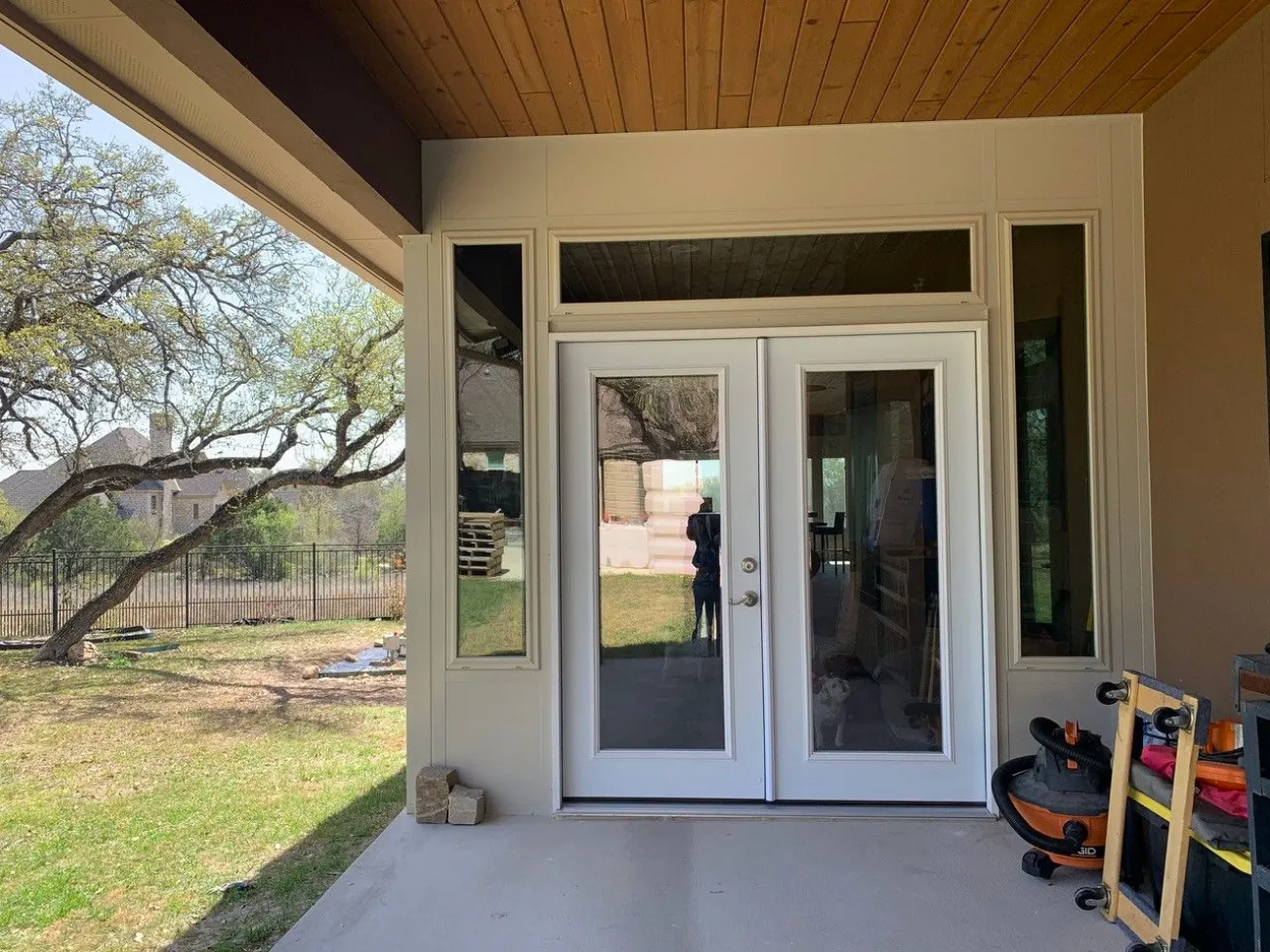 patio cover adjacent to two white doors in san antonio
