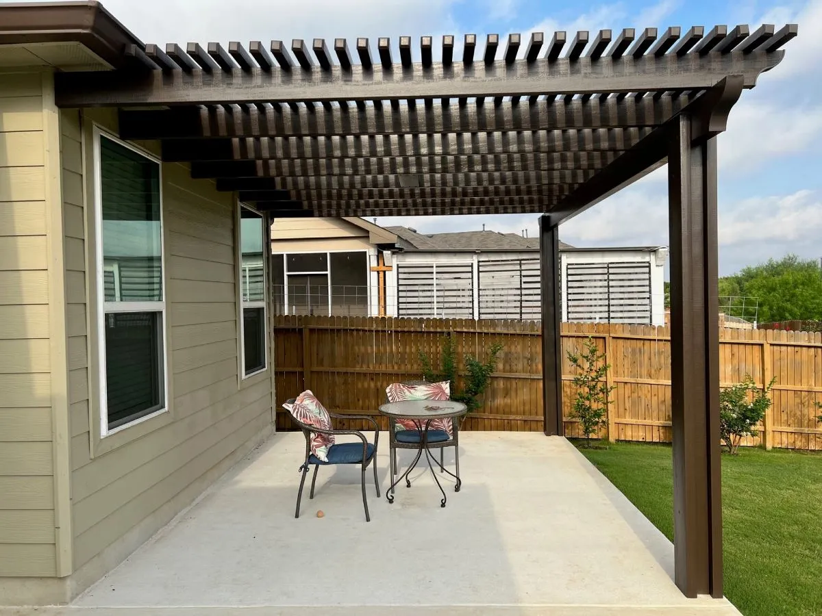 Wooden pergola over patio with table and chairs, San Antonio.