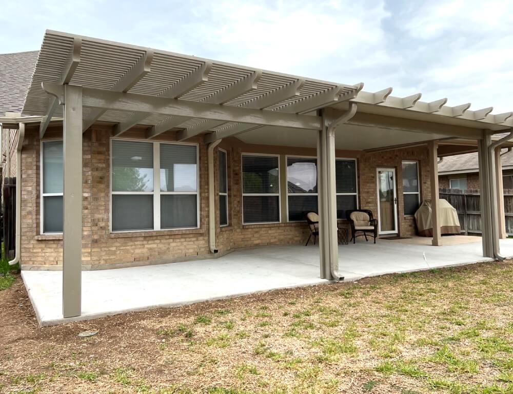 A backyard patio with a pergola in San Antonio.
