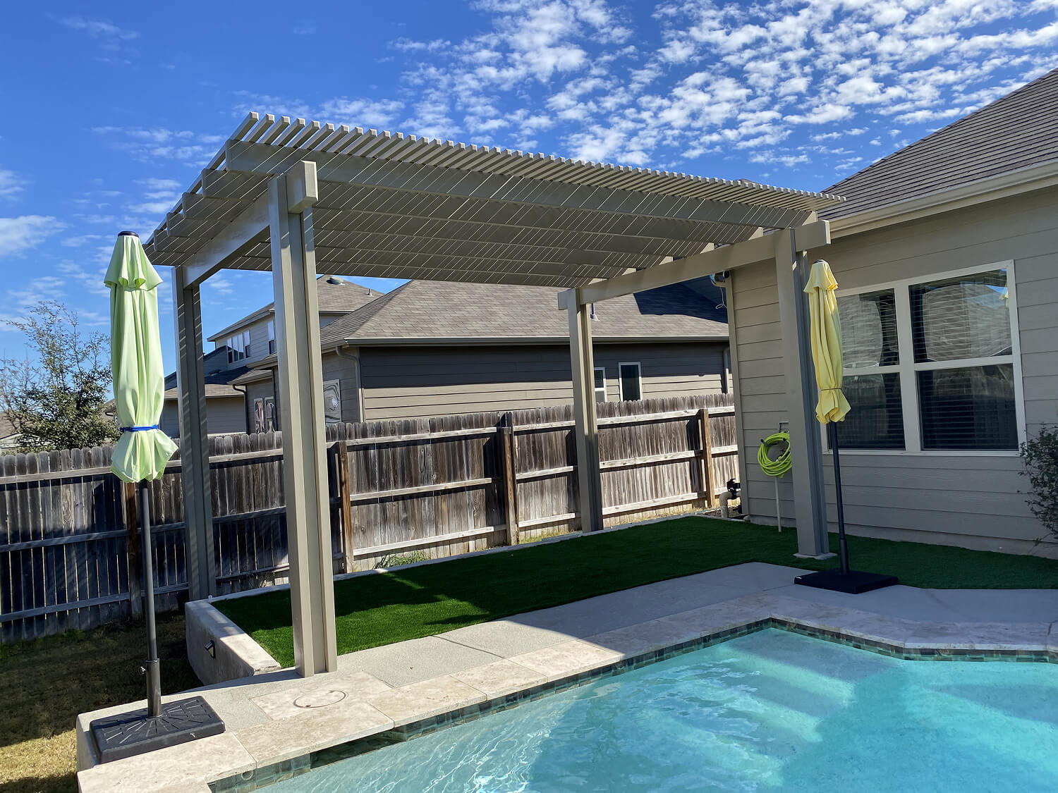 Backyard pergola over pool in San Antonio.