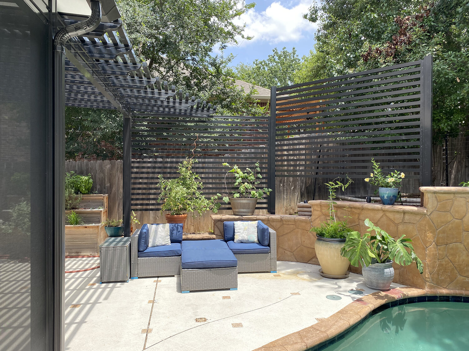 Poolside patio with pergola and seating in San Antonio.