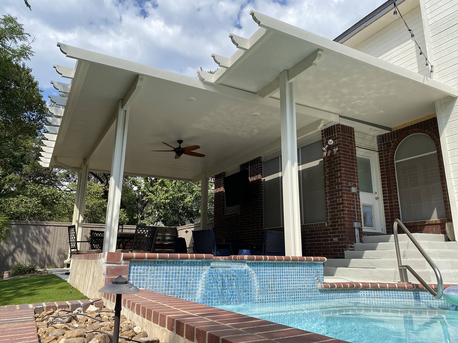 Pergola and patio cover near pool, San Antonio home.