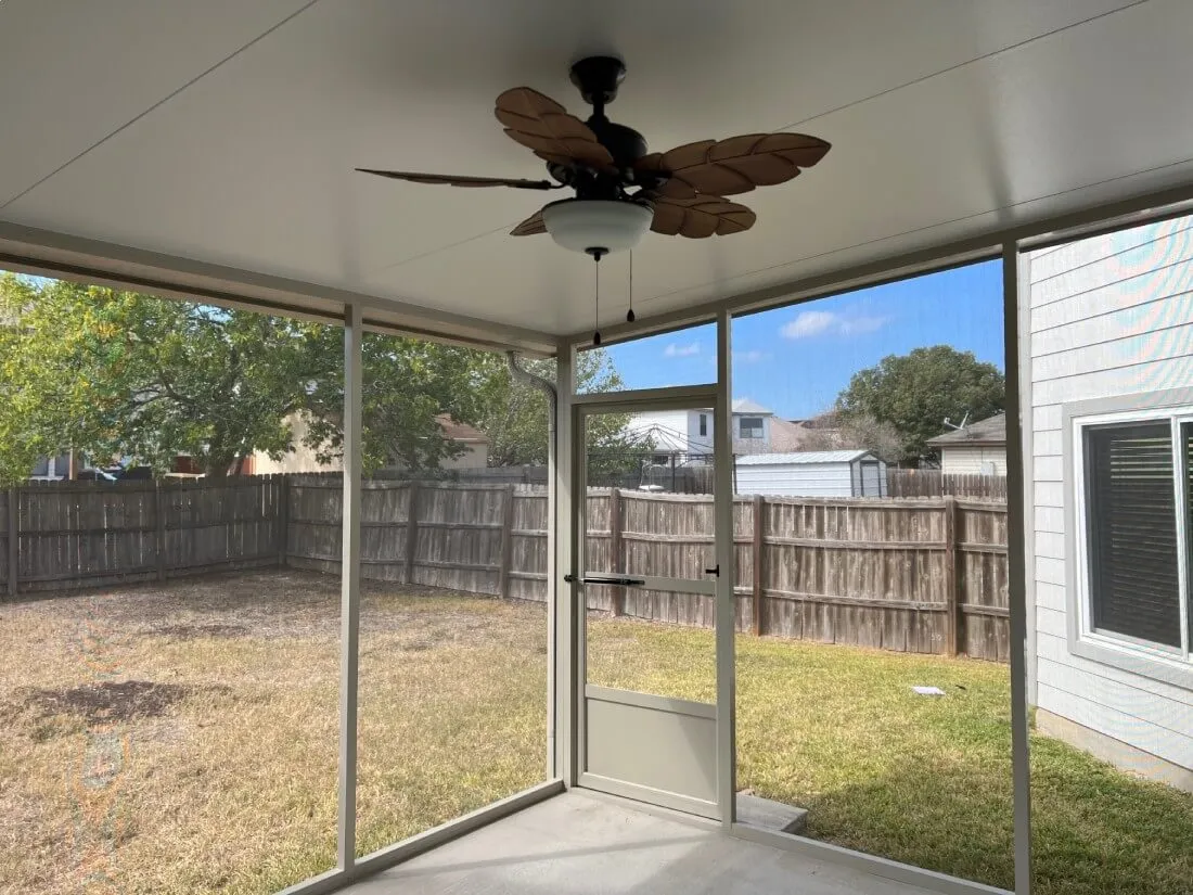 Enclosed patio with fan in San Antonio backyard.