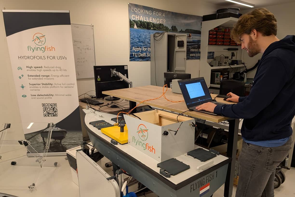 Photo of a Flying Fish engineer, working on the Flying Fish 1 hydrofoil demonstrator vessel in the workshop.