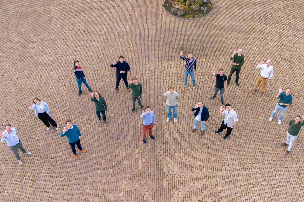 Group photo of the Flying Fish team, waving at the camera above. 