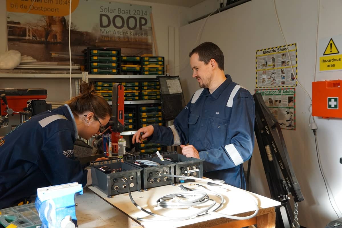 Photo of two Flying Fish engineers working in the their workshop.