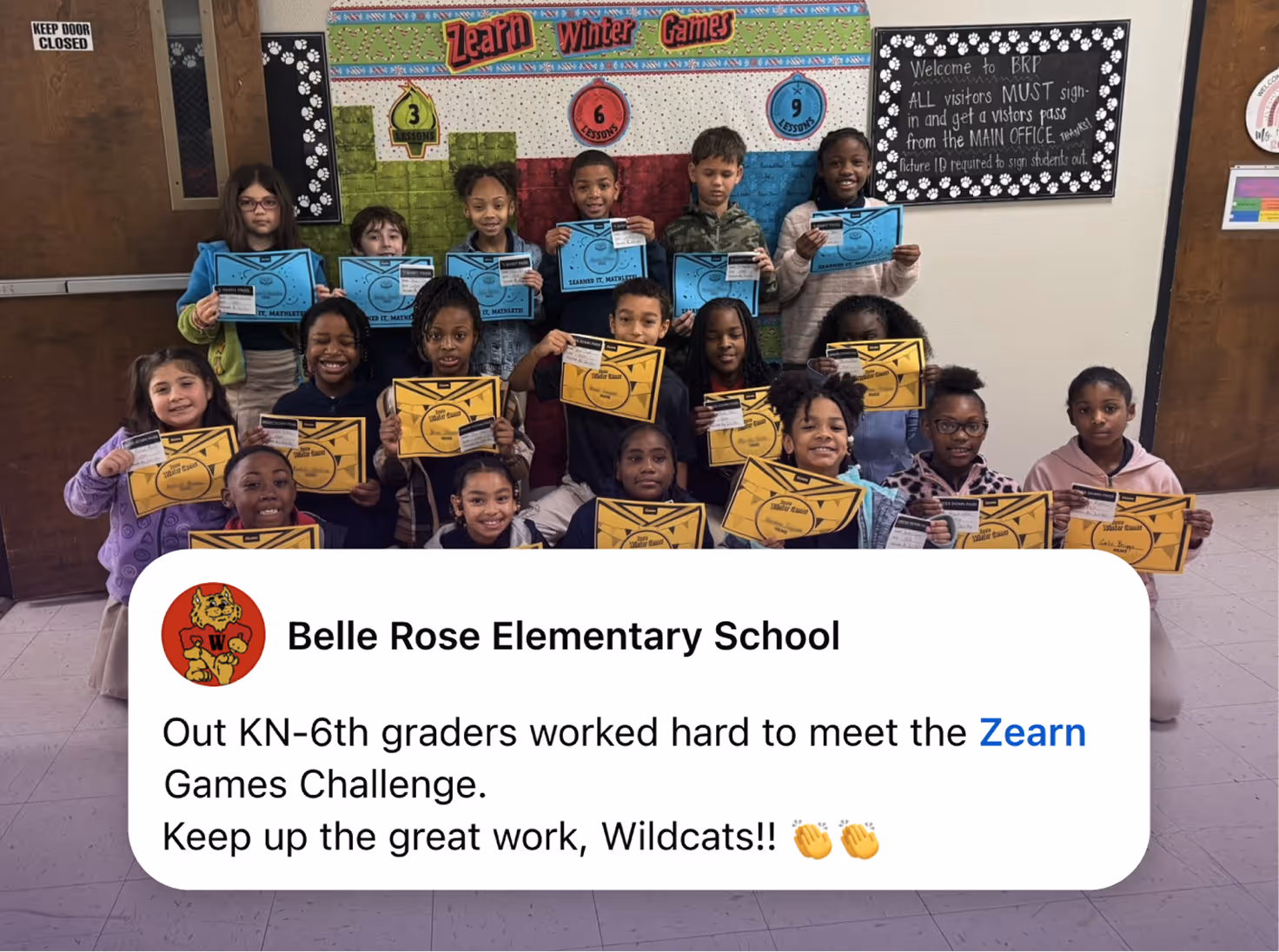 Group of elementary students holding certificates for completing the Zearn Games Challenge.
