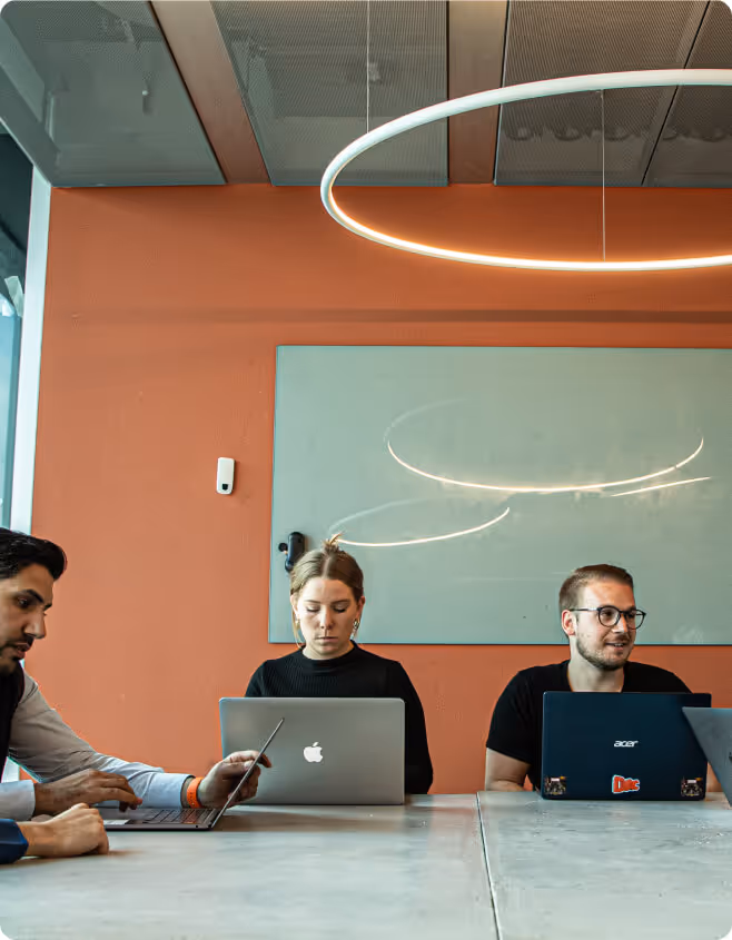 people working in a space that is monitored by ubiqisense sensor