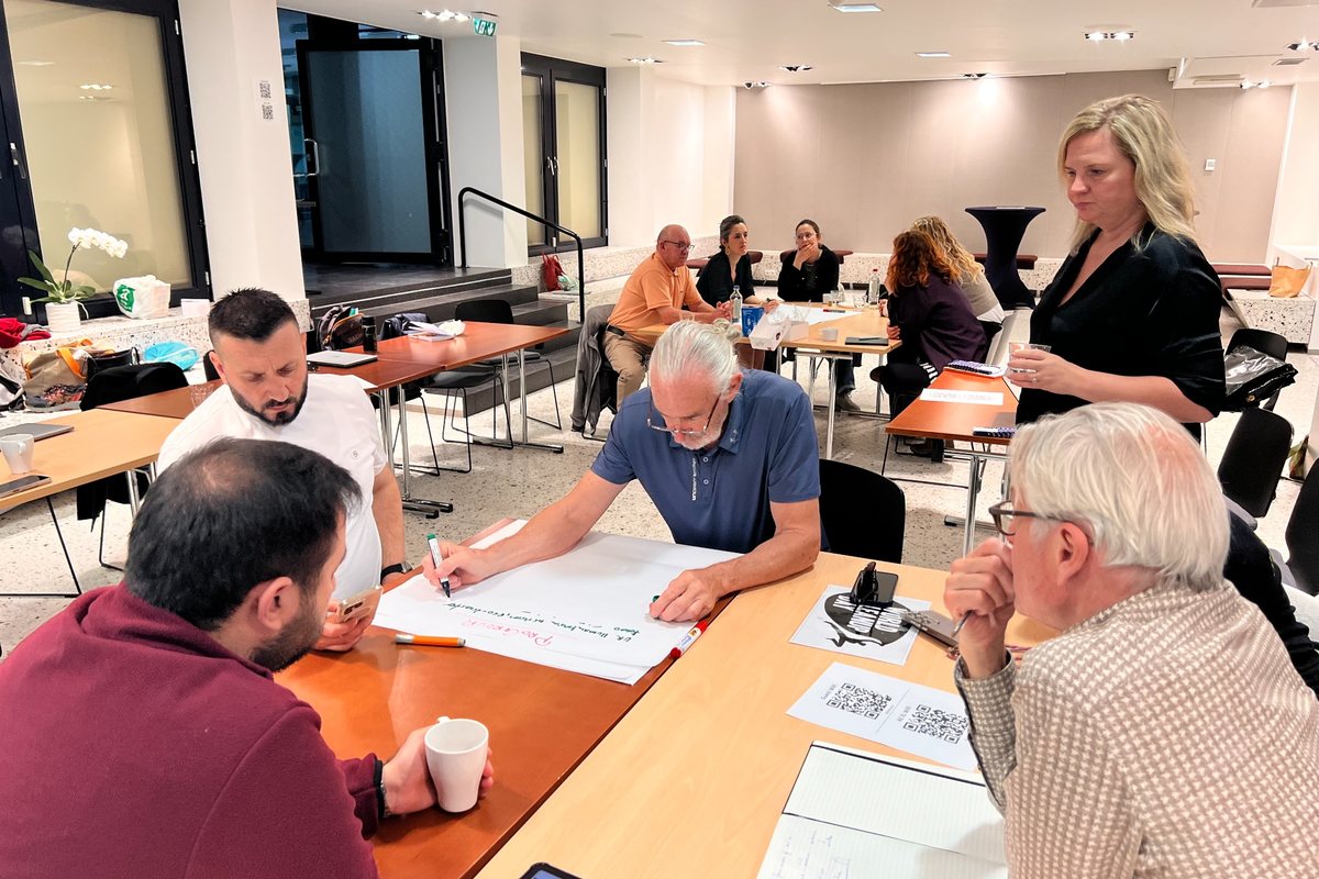 A small group discussing ideas during a facilitated working session