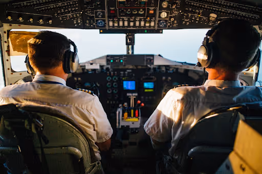 Two pilots in an airport cockpit