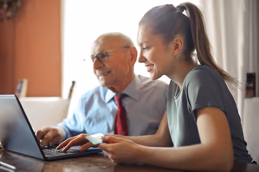 man woman working in a laptop