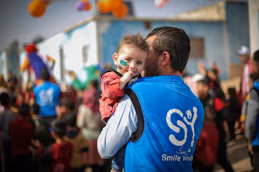 Man Holding his kid walking