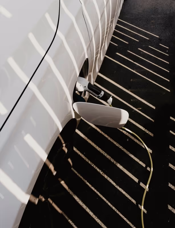 A white car parked in a parking lot.