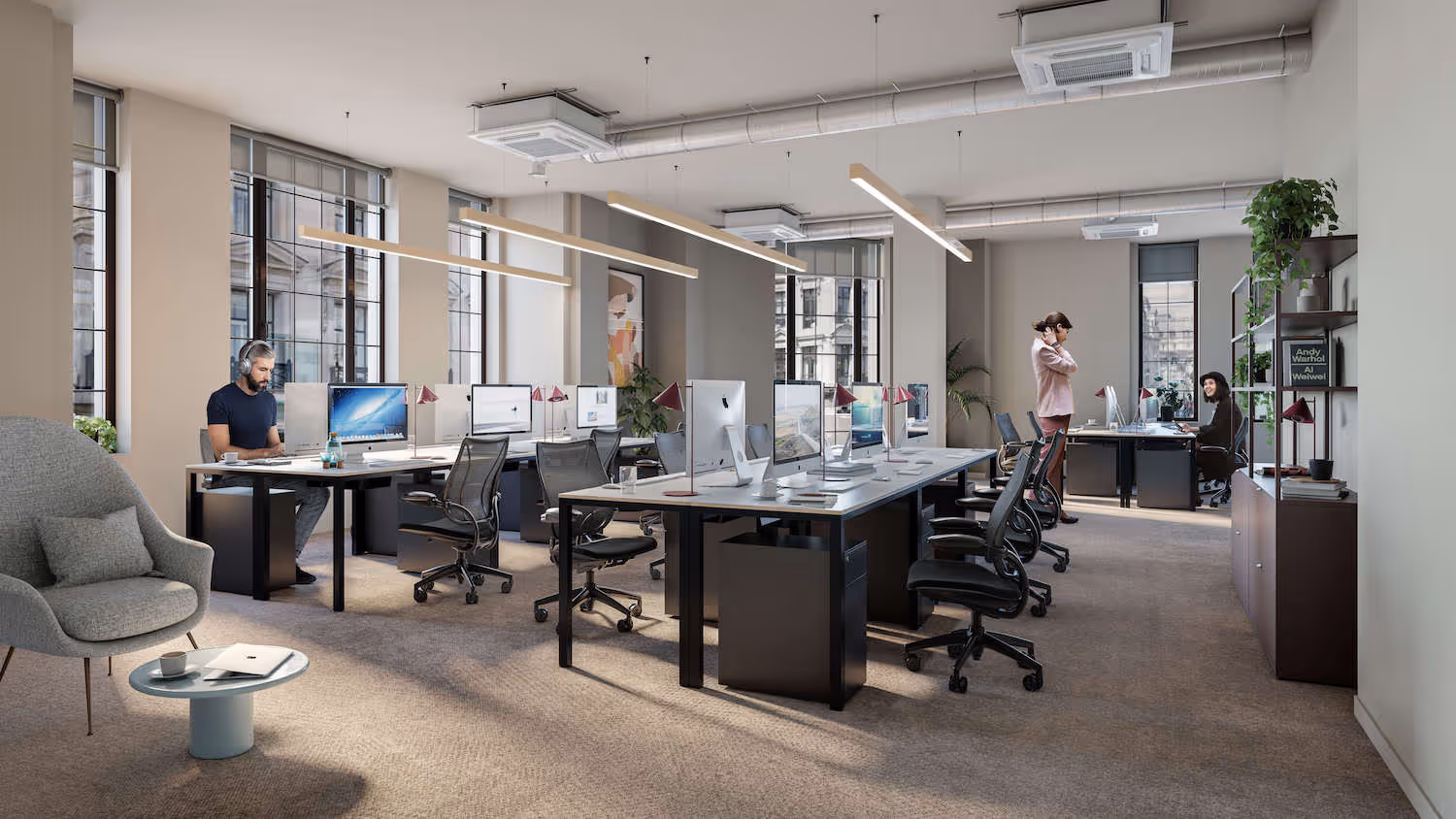 People working in a private office space 