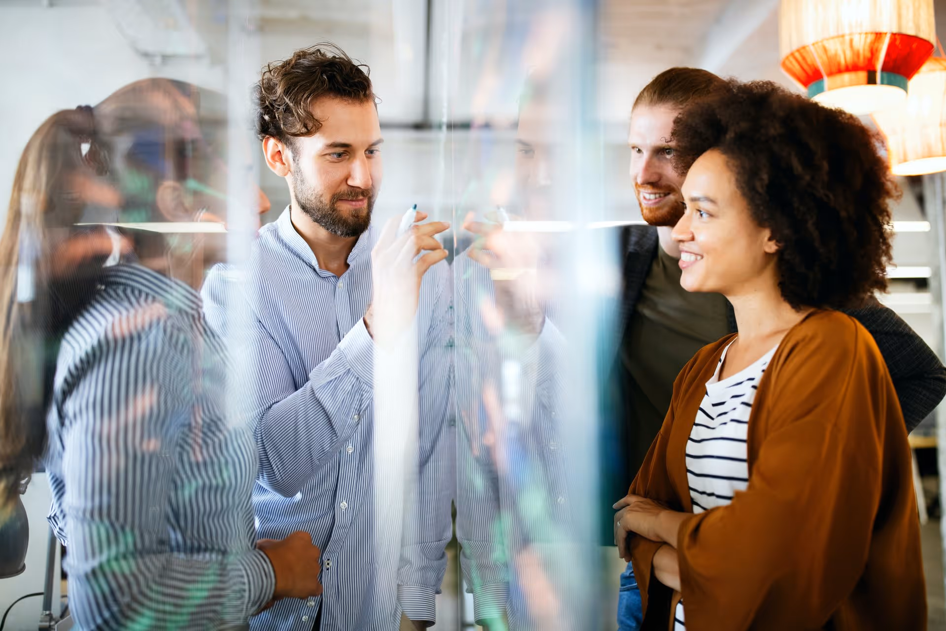 A small team collaborating in a breakput space in a serviced office in Camden, London.