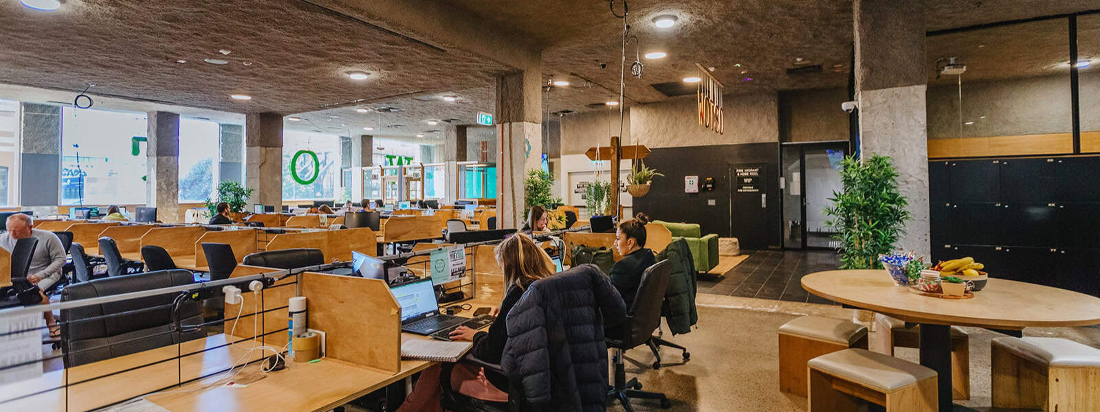 Breakout space within a coworking space in Perth is being used by a small team to collaborate on a project.