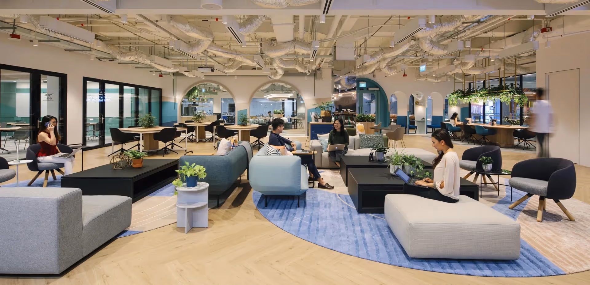 A bright, spacious breakout space within a serviced office space in Singapore.