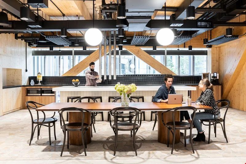A small team is collaborating in a breakout space in an a coworking space in Adelaide.