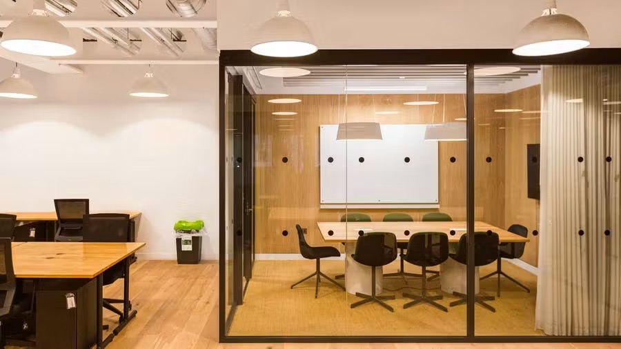 A private meeting room contained within a private office space in Cambridge.