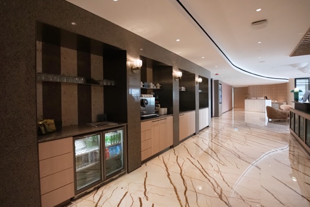 A modern reception area of a private office space in Singapore.