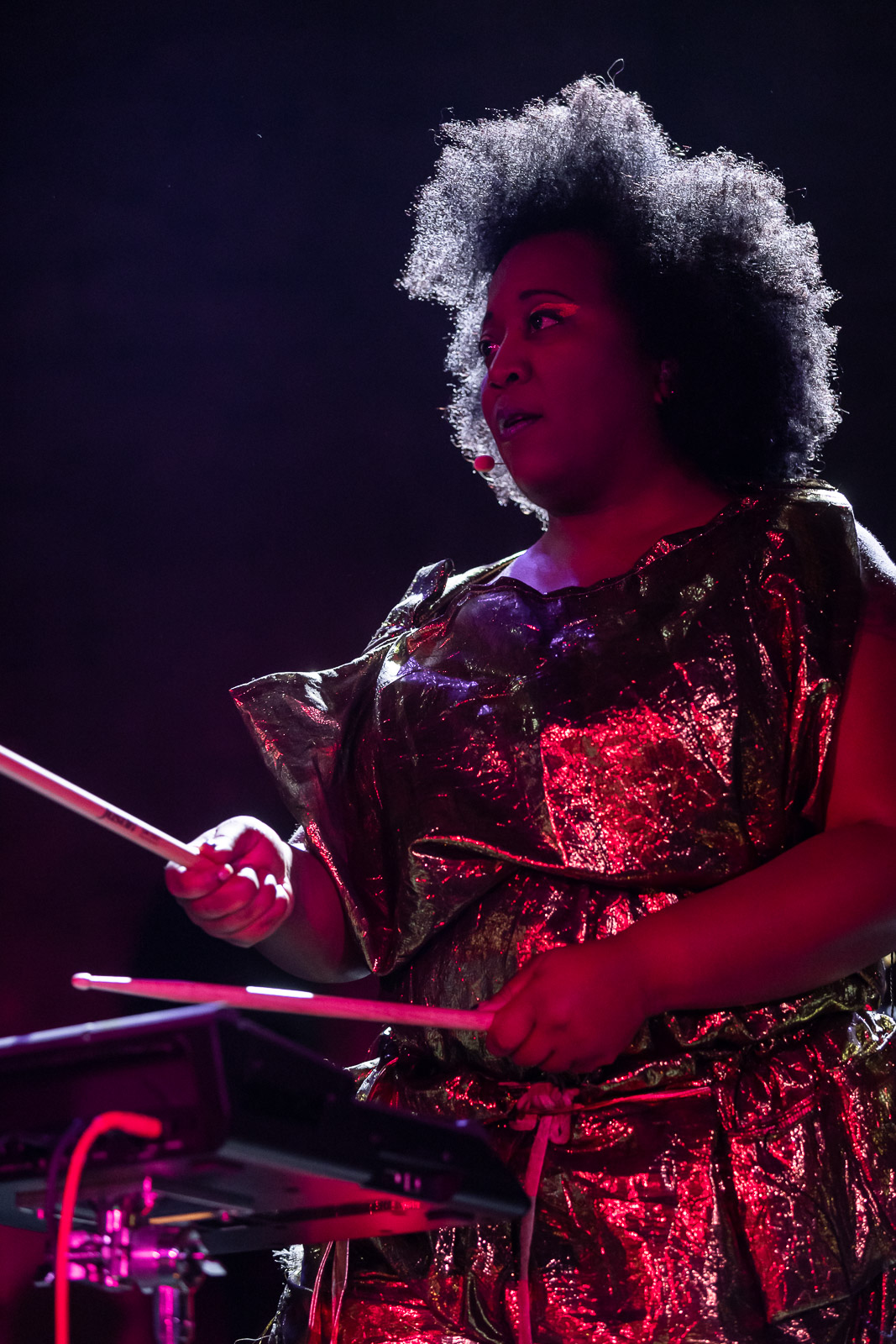 Sky Deep on stage under dramatic purple concert lighting during a live show.