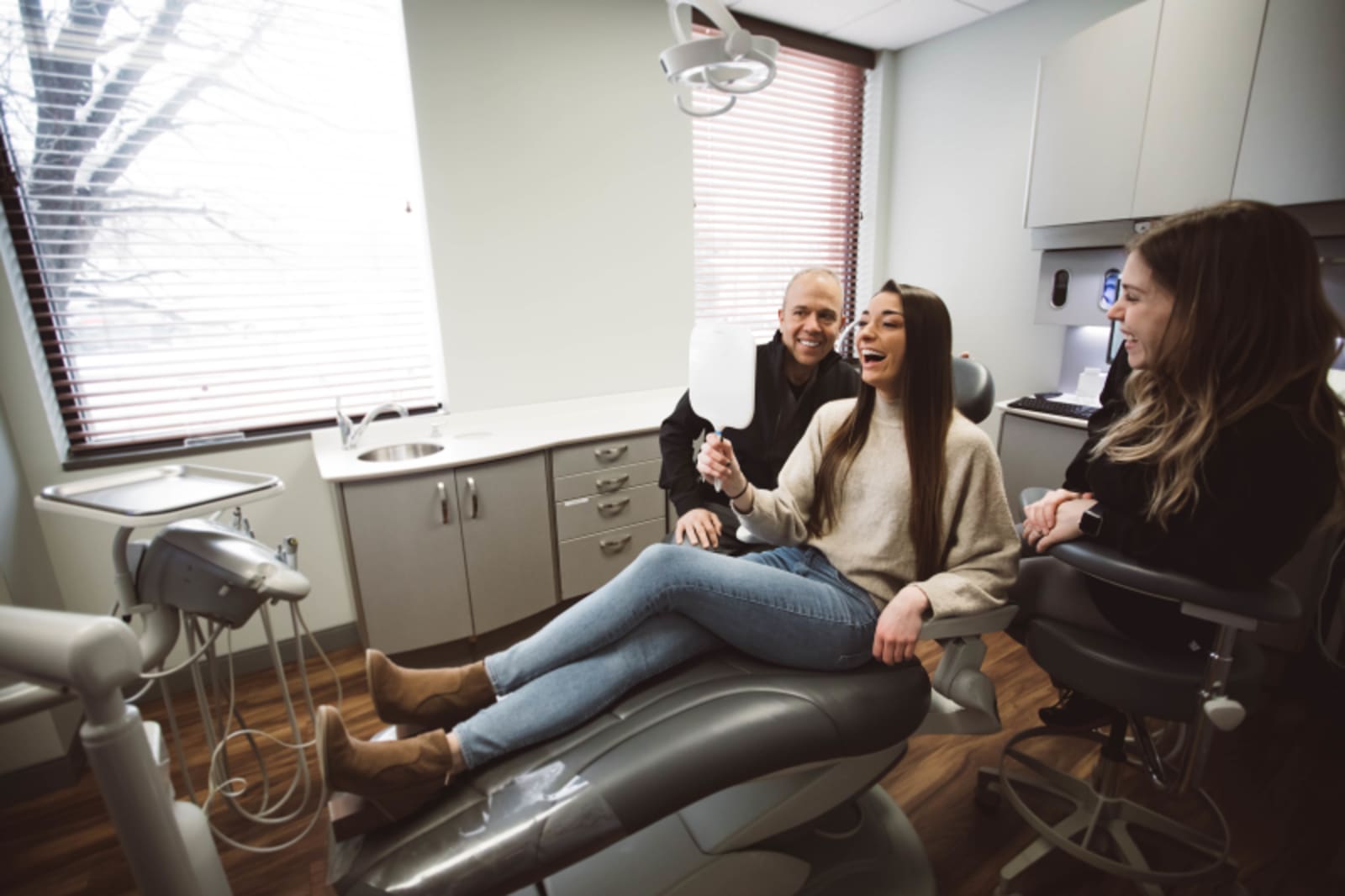 Dentist discussing treatment plan with patient in clinical setting
