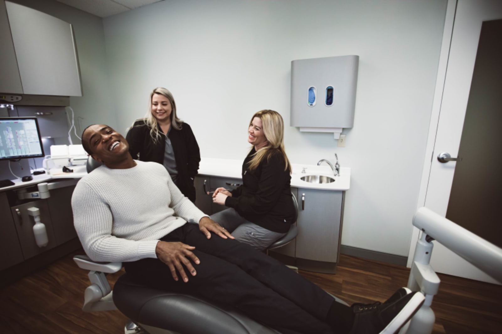 Dentist discussing treatment options with patient during clinical consultation