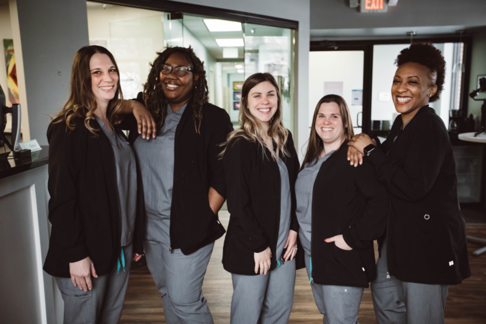 Edgewood Dental Associates team members posing together in the office