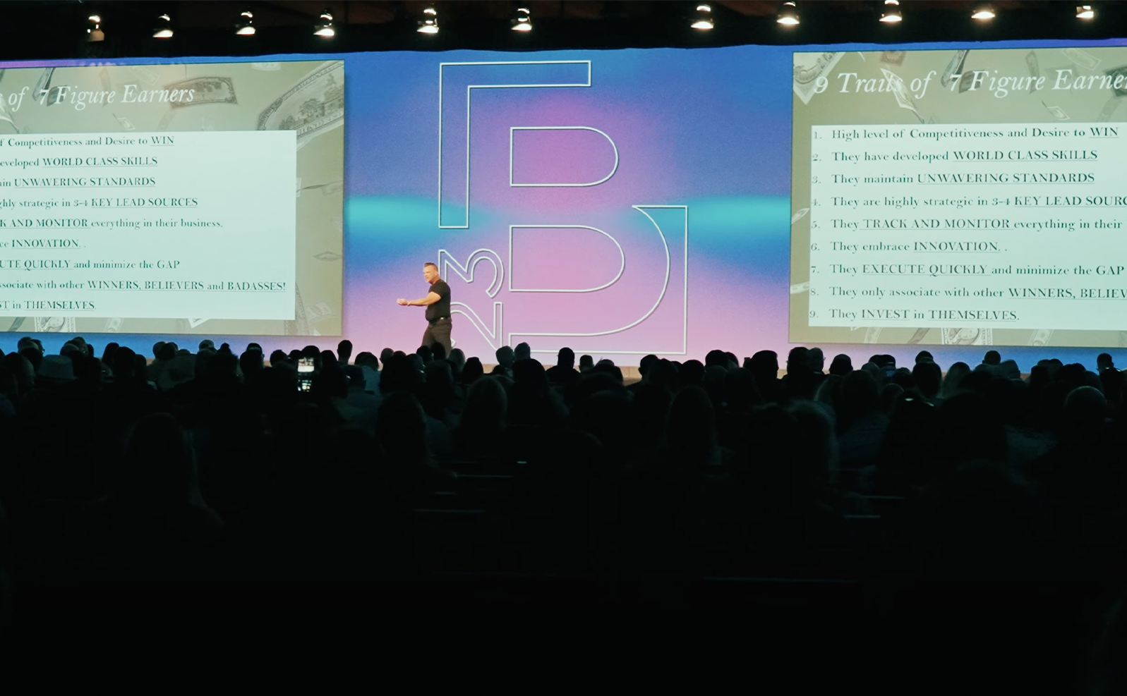 Keynote speaker on stage at a conference