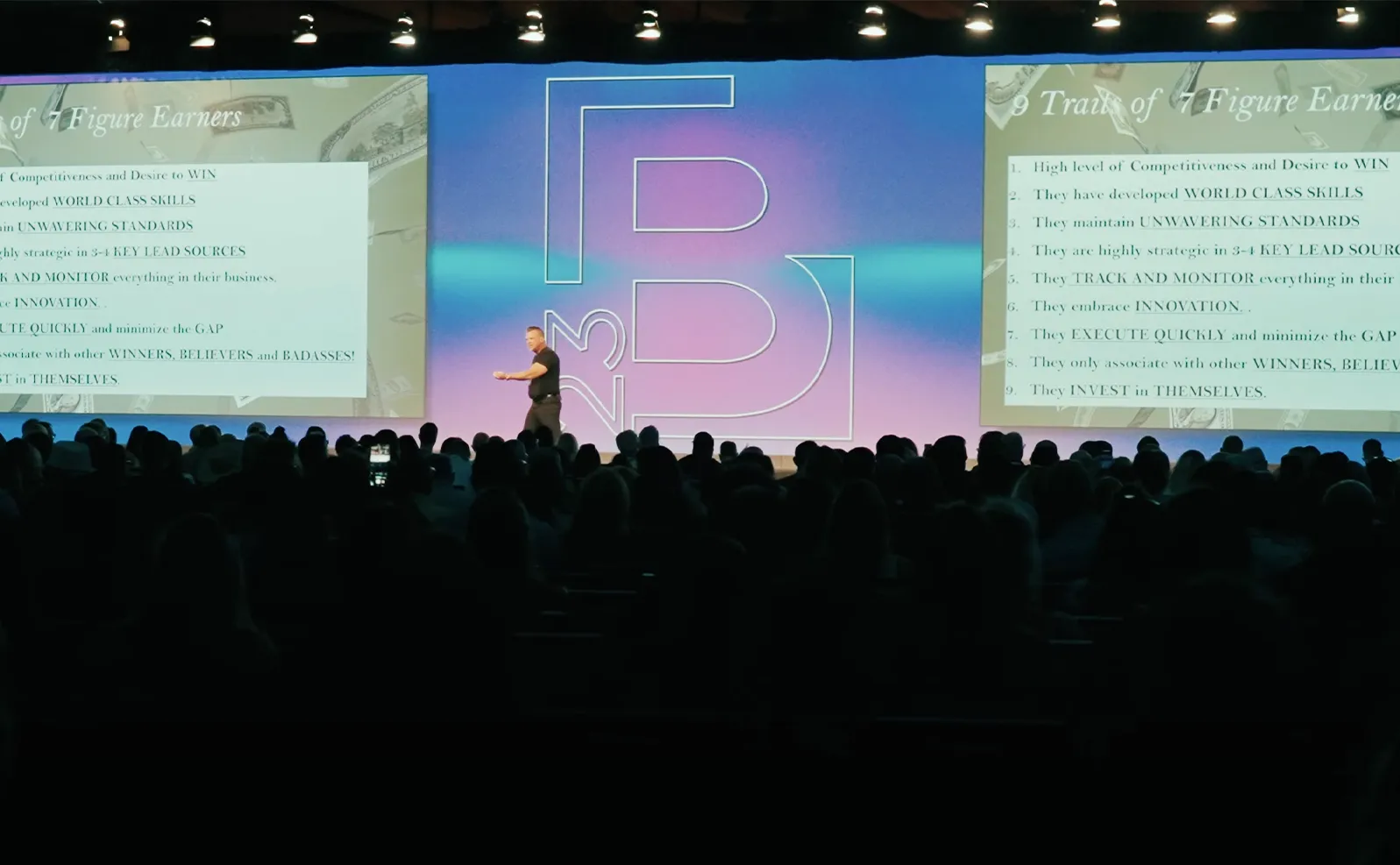 Keynote speaker on stage at a conference