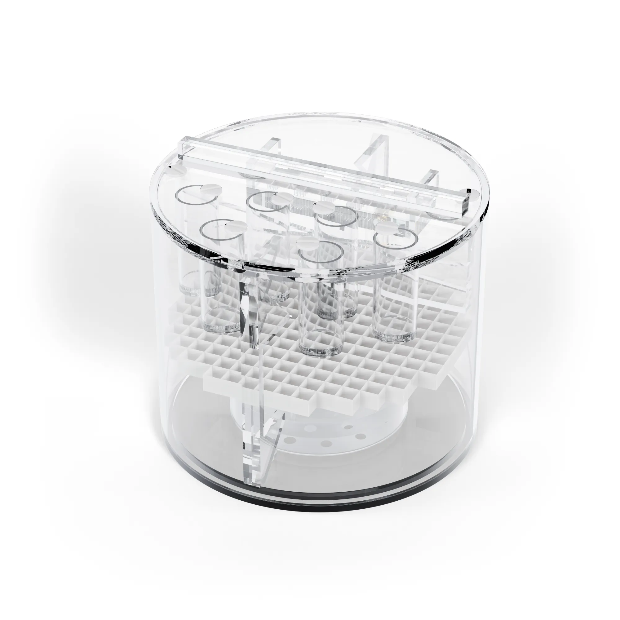 Przezroczysty akrylowy cylinder o wielu kształtach testowych wewnątrz i wypełniony zielonkawym płynem.