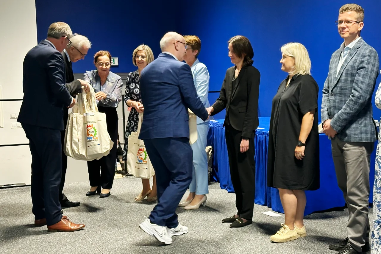 Award sponsors and teachers receiving thank-you gifts during the Technical Innovation Olympiads ceremony in Chełm