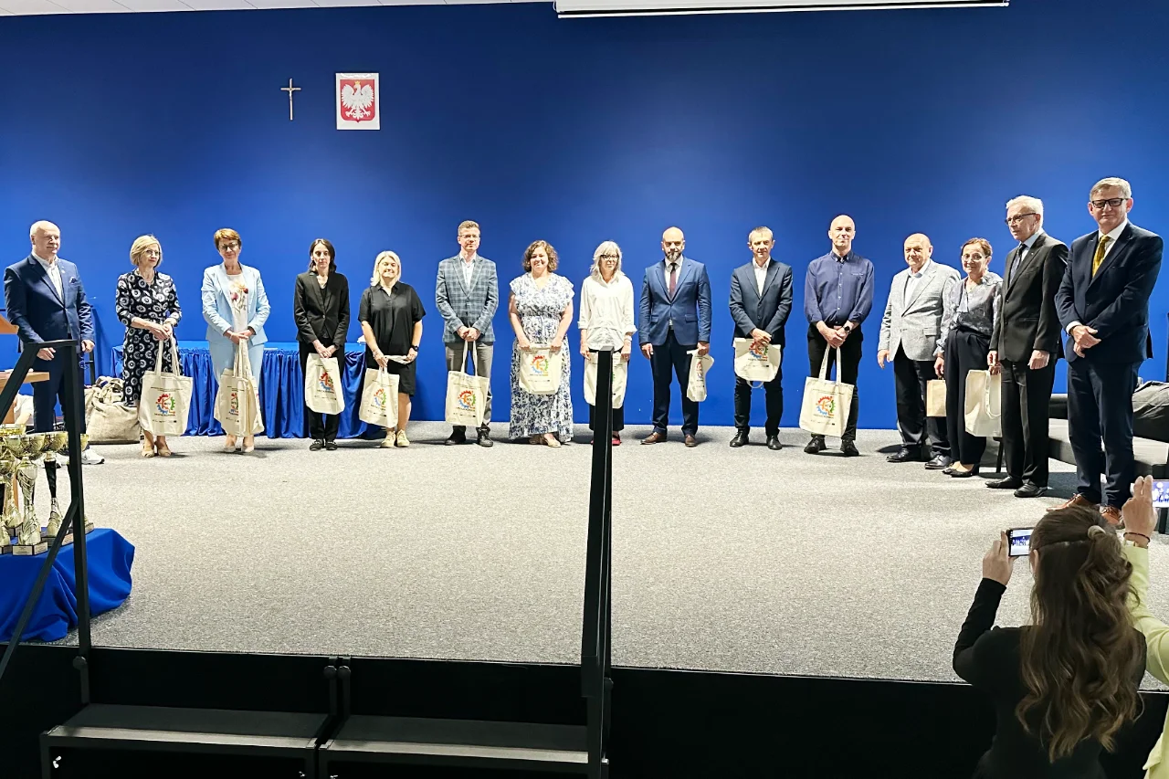 Teachers, project supervisors and award sponsors on stage at the Technical Innovation Olympiads ceremony in Chełm