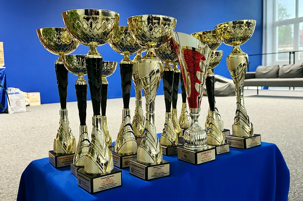Gold trophies with engraved nameplates for the Technical Innovation Olympiads laureates from the Chełm region