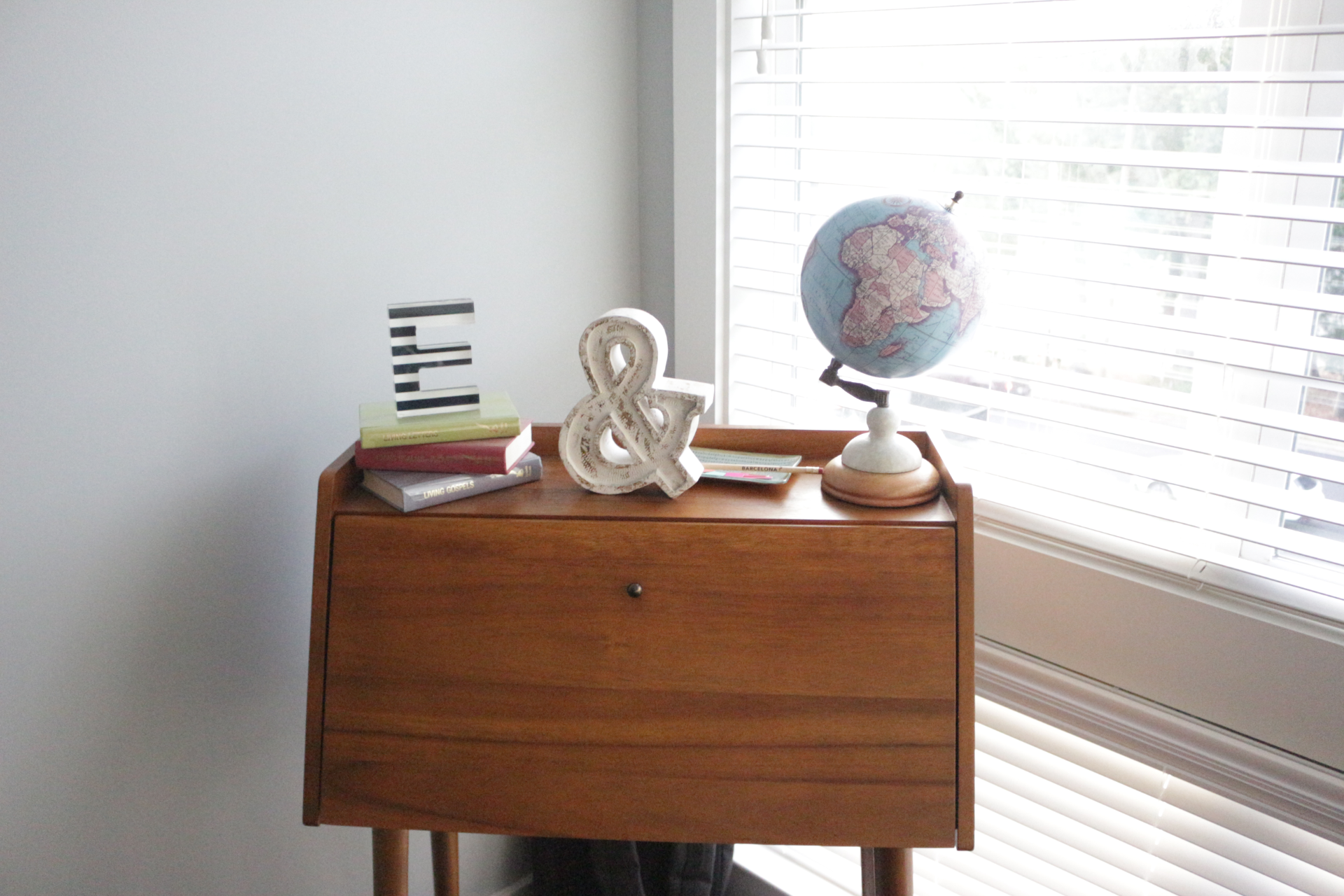 a picture of a working computer desk with decorative sculptures on top