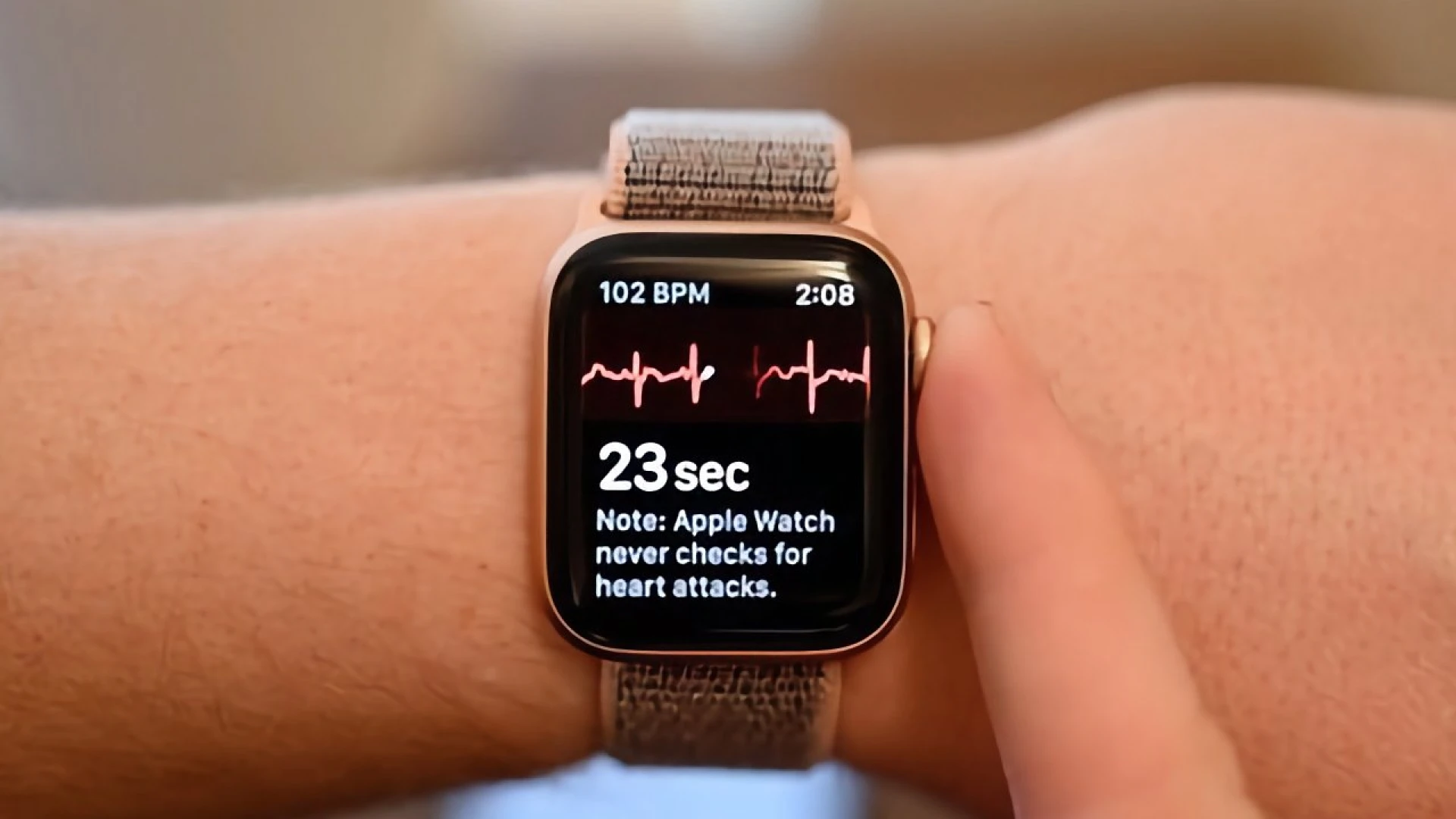 Person taking ECG with Apple Watch
