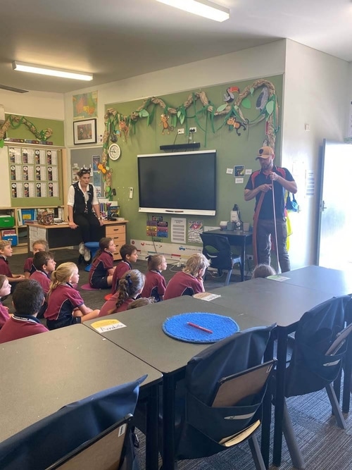 Hunter Barnes educating in a school